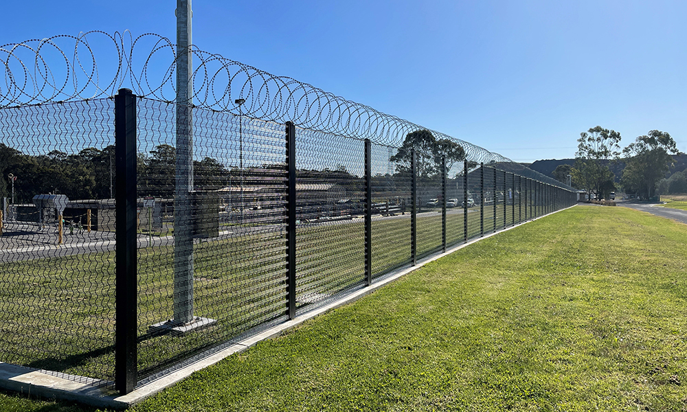 High-security steel perimeter fencing at a commercial site
